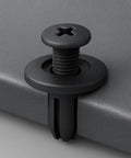 Close-up of black push-in retainer clip from 100 Piece Front Fender Clip Kit Push In Nylon Retainer Clips Fasteners Rivets 15mm Head 12mm Stem 6mm Hole Black Fits Honda Cars Replaces 90683 SA5 003 Auto Body Trim Clips installed on surface.