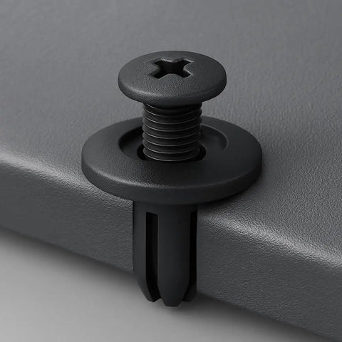 Close-up of black push-in retainer clip from 100 Piece Front Fender Clip Kit Push In Nylon Retainer Clips Fasteners Rivets 15mm Head 12mm Stem 6mm Hole Black Fits Honda Cars Replaces 90683 SA5 003 Auto Body Trim Clips installed on surface.
