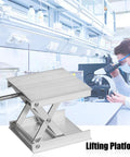 Lab lifting platform jack; stainless steel scissor lift with screw clamp, front view