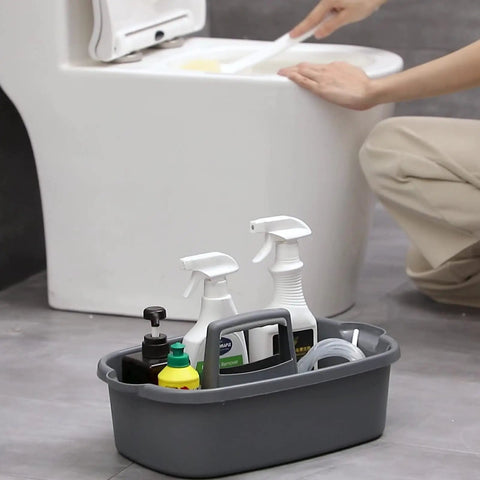 Must Have Cleaning Caddy Organizer With Handy Handle next to toilet, holding spray bottles and cleaning supplies