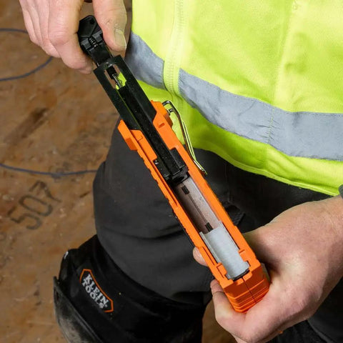 Person loading Heavy Duty Insulated Staples For Romex And NM Cables 19 32 By 11 32 Inch Boss Grade Secure Install stapler