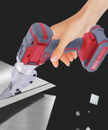 Professional 36V Electric Metal Shears with Swivel Head cutting through steel sheet, showcasing precision and cordless design.