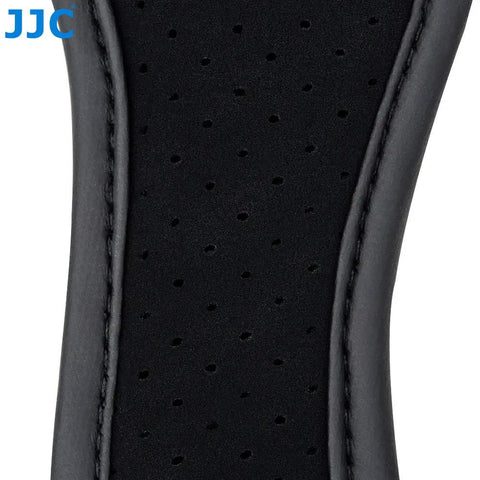 Close-up of Pro Mirrorless Camera Hand Grip Strap With Arca Type Plate, showing detailed stitching and perforated leather material.