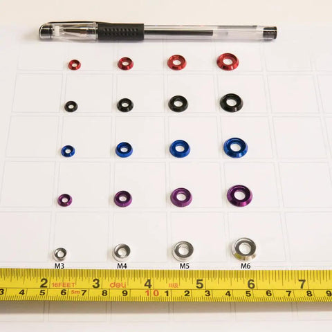 60Pcs M4 Counterbore Washers Anodized Aluminum Alloy Black For RC FPV Drones shown in size comparison with pen and tape measure