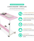 Height Adjustable Mobile Laptop Desk Sets The Chill Vibe For Remote Work Sessions While Rolling On Slick Casters And Locks Down Tight For Ultimate Stability with dark pink top and rolling casters.