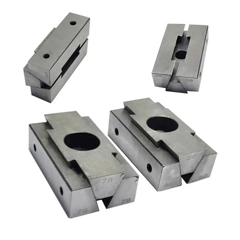 Pro Grade Workhorse Machining Center Fixture Built Like A Tank Rock Solid Side By Side Multi Station Clamp Top Shelf Wedge Shaped Expansion Tool With Bilateral M10 Threading For Shop Floors - Group of wedge shaped clamps with holes.