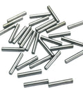 Knockout Quality Heavy Hitter 30 Pack 1/8 X 3/4 Inch Alloy Steel Dowel Pins scattered on a white background.