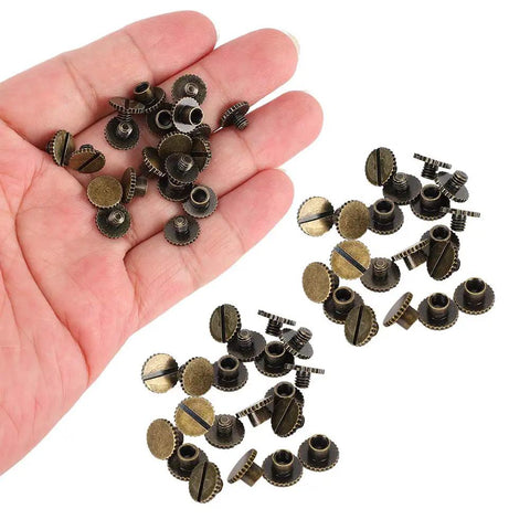 Hand holding 30 Pack Brass Book Rivets With Knurling Flat Leather Binding Buttons for DIY craft, bronze finish, 9.5 by 4mm nails