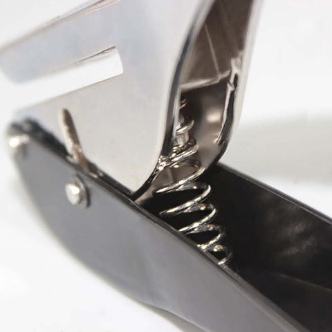 Close-up of 8mm Hole Paper Punch One Hole Puncher handheld for office use with strong spring mechanism