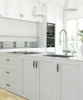 Modern kitchen with white cabinets featuring Black And Gold Cabinet Pulls 10 Pack 5 Inch Hole Center Drawer Handles installed.