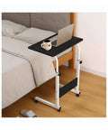 Smooth Rolling Mobile Laptop Stand With Hella Spacious Top And Adjustable Height Portable Overbed Desk for beds with laptop and mug.