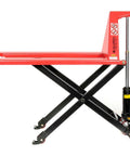 Real Deal Heavy Duty Manual High Lift Skid Jack Truck For Single Faced Pallets With Wide Poly Steer Wheels And Smooth Roll Out 2200 Lb Capacity Vibrant Red Color side view showcasing hydraulic lift mechanism.