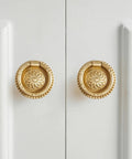 Dope Vintage Solid Brass Ring Pull Drawer Knobs Set Of 20 In Satin Gold Finish With Antique Bronze Accents on white cabinet