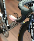 Black bike handlebar with brake levers, featuring Shimano hood covers. Silicone Hood Covers For Bike Brake Levers And Shifters.