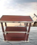 Tough As Nails Heavy Duty Industrial Kitchen Cart With Smooth Rolling Wheels And Built In Wine Rack Three Tier Storage Trolley side view with wood and metal design.