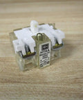 Heavy Duty Ht8a Normally Open Contact Block For Thirty Millimeter Push Buttons And Switches, side view on wooden surface.
