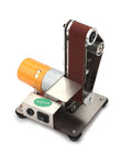 Dial Up Precision With This Versatile Electric Belt Sander And Mini Bench Grinder. Compact orange motor with a sanding belt.