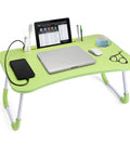 Foldable Laptop Desk Bed Table Portable Lap Tray For Bed Couch Sofa Or Floor with devices, glasses, and cup on green surface