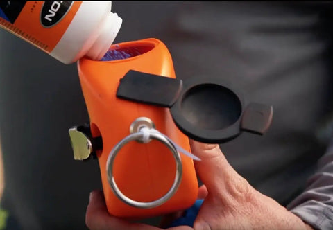 Adding chalk to G130 Giant Chalk Line Reel With 24 Ounce Chalk Capacity And 130 Foot Reach Heavy Duty Rewind Crank Glovable Grip