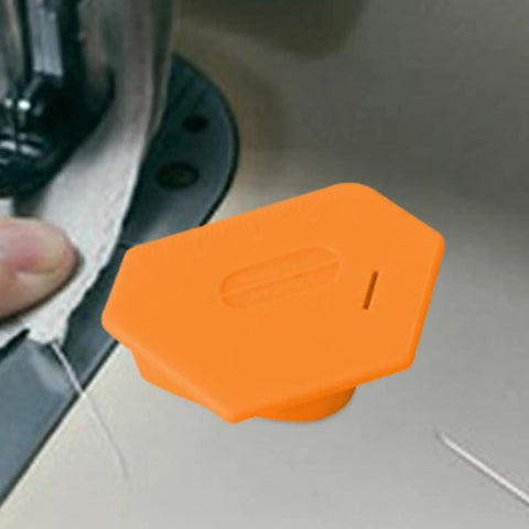 Magnetic Seam Guide For Sewing, orange tool on sewing machine, secure magnet attachment for precise hem alignment on fabric