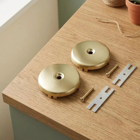 ANDRESLAD Single Hole Bathtub Overflow Drain Plate Pack of 2 with Screw, gold finish, screws and brackets included on a wooden surface.