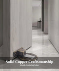 Heavy Duty Floor Door Catch Black Keeps Doors From Slamming Shut with secure base plate in modern hallway setting.