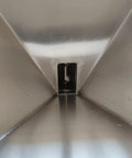 Interior view of stainless steel vibrating hopper from a 4.5 inch inclined auger feeder for powder feeding, part of a screw conveyor system.