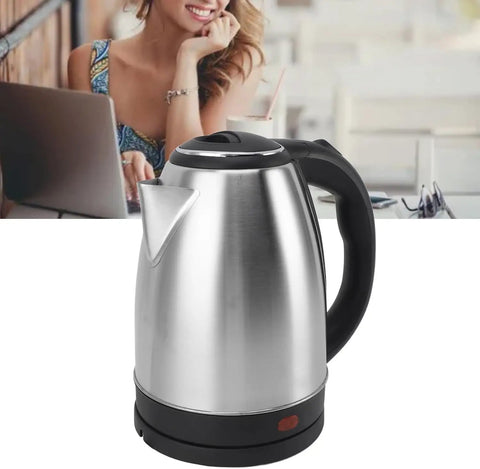 Fast As Lightning 2 Liter Electric Kettle With 1500 Watt Kickin Boiling Power Auto Shut Off And Dry Boil Protection Stainless steel kettle with black handle on kitchen counter.