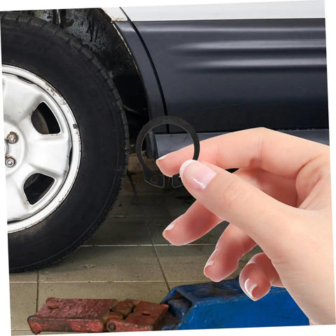 Hand holding snap ring from Two Pack Hydraulic Jack Circlip Retaining Snap Ring Set For External Circlips Easy Install Durable Steel