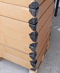 Stacked boxes with Heavy Duty 1000 Pieces PP Plastic Corner Protectors for Boxes and Cartons, 60x60x60 mm edge guards applied.