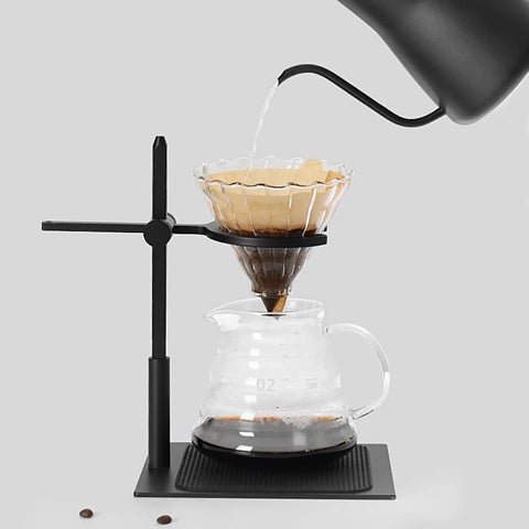 Adjustable Pour Over Coffee Stand Featuring Rock Solid Aluminum Base For Home Office Brewing with a drip coffee setup in use.