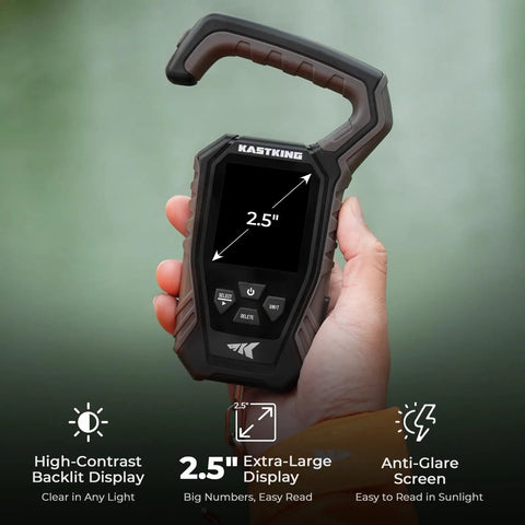 Person holding the WeighMaster Mechanical Digital Fishing Scale With Lip Gripper 120 Lb Capacity 2.5 Inch Backlit Display