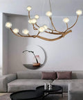 Modern Glass Bubble Chandelier With Sleek Wood Branch Accents, Rustic Industrial Flush Mount Pendant Light For Living Room, Adjustable Hanging Lamp above a sofa.