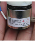 Close-up of a small DC-24V electromagnetic clutch with metal cylindrical housing and Ogura Clutch Co. label G-J12