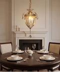 vhhob French Light Luxury Crystal Pendant Lamp Ceiling Hanging Fixture above a dining table set for dinner.