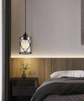 Fresh Matte Black Three Light Pendant With Clear Glass Shades Adjustable Farmhouse Industrial Hanging Fixture For Kitchen Island And Dining Room Decor Solid Home Upgrade Ceiling Lamp hanging above a bedside table.