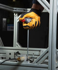 Worker using Tough As Nails T-Handle Hex Key Set With Stand, 10-Piece SAE Inch Wrenches for high torque on metal frame
