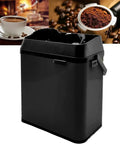 Badass Electric Portafilter Cleaner Knock Box With 150W Motor And Stainless Steel Body For No Sweat Coffee Ground Disposal Including Quick Scraper Tool in black, designed for easy grounds disposal.