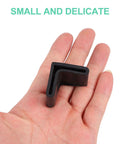 L Shape Black Rubber Furniture Leg Caps Set For Tables And Shelves Floor Protectors in hand, showing small size and L shape.