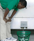 Green Golf Ball Basket With Handle, Holds Up To 50 Balls, positioned beneath ball dispenser, used for outdoor practice
