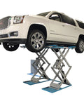 Shop Beast Commercial Scissors Lift, 9000 Lb Auto Garage Hoist lifting a GMC SUV, showcasing adjustable width and open center design.