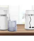 Built Tough Water Distiller Machine Packs 750 Watt Heating Coil with four liter catch bucket on kitchen counter.