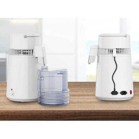 Built Tough Water Distiller Machine Packs 750 Watt Heating Coil with four liter catch bucket on kitchen counter.