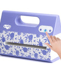 Purple Portable Automatic A4 Die Cutting Machine With 9 Inch Embossing Kit for Card Making being powered on.