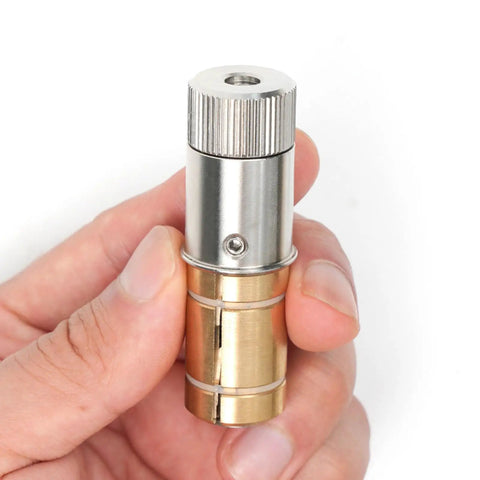Hand holding stainless steel expansion pins for MFT table holes and locking bench stops, showing vibration resistant design.