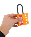 Badass Multi User Insulated Nylon Lockout Hasp With Four Reinforced Holes For Safety Tagout Protocols Built Tough held in hand.