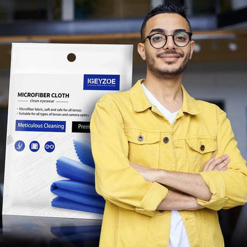 Front view of 20-pack blue microfiber glasses cleaning cloths in packaging beside a man wearing a yellow jacket