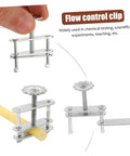 Hand holding water stop clip tubing clamp, shown securing a yellow tube for lab flow control. Focus: Twenty Pack Spring Water Stop Clip Tubing Clamps For Lab Flow Control And Leakproof Pro Grade Scientific Experiments Ideal For Research And Teaching Labs Medical And Industrial Applications.