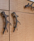 Antique Bronze Finish Cast Iron Deer Antler Drawer Pulls Set Of Six For Cabinets installed on wooden cabinet doors