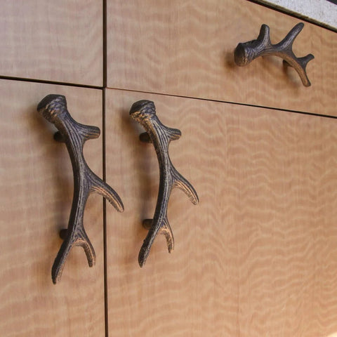 Antique Bronze Finish Cast Iron Deer Antler Drawer Pulls Set Of Six For Cabinets installed on wooden cabinet doors